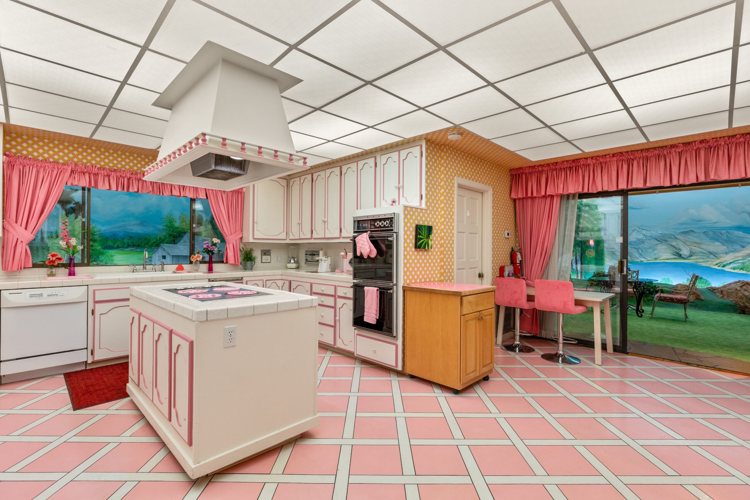 Kathryn Bigelow’s ‘House of Dynamite’ Brings Nuclear Danger but Homeowners Have Already Been Digging In. What’s the ROI on Backyard Bunkers? 13 Kitchen in an underground bunker with windows to painted backyard scenes. Credit: Rooted Elements Media