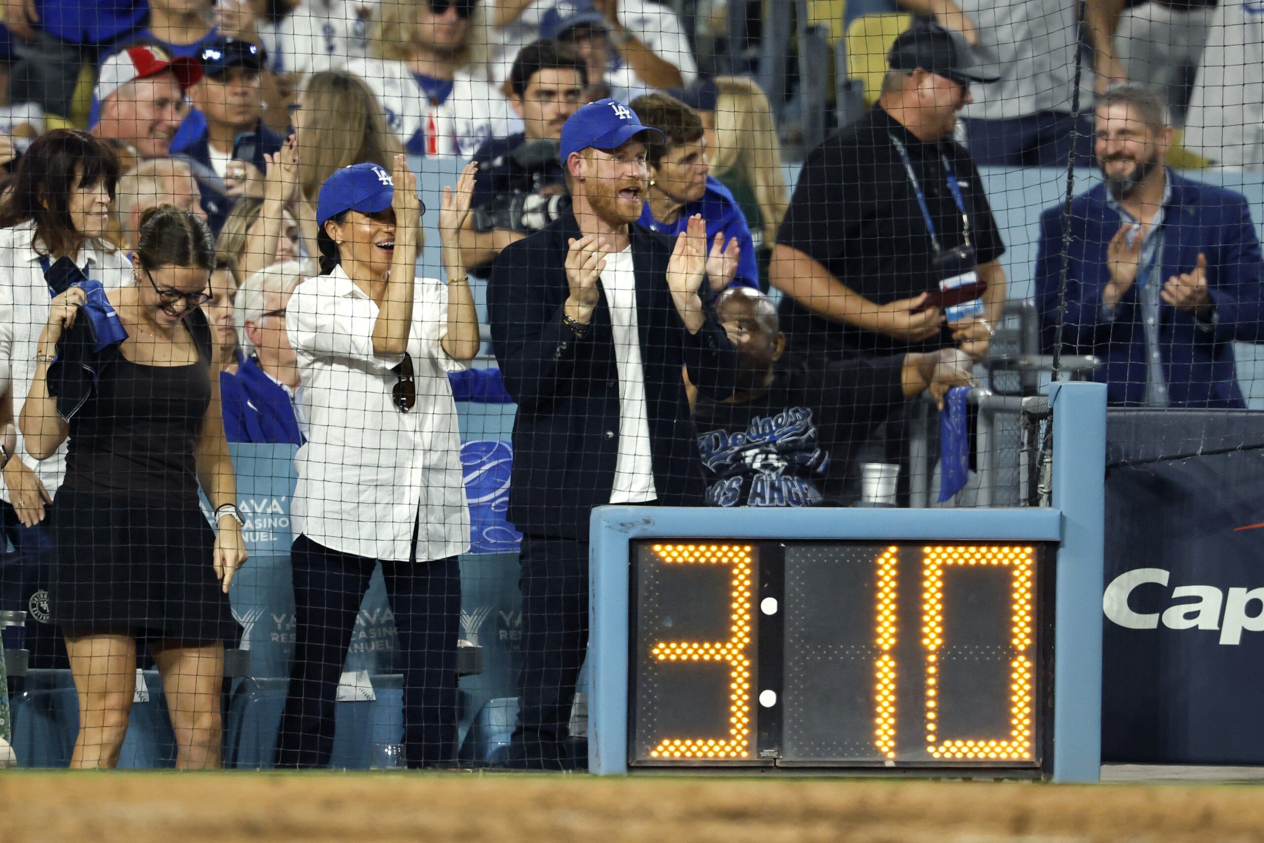 Prince Harry Proves Himself To Be a True Angeleno as He Cheers on L.A. Dodgers in World Series 1 LOS ANGELES, CALIFORNIA - OCTOBER 28: Prince Harry, Duke of Sussex and Meghan, Duchess of Sussex react during the fifth inning of game four of the 2025 World Series between the Toronto Blue Jays and the Los Angeles Dodgers at Dodger Stadium on October 28, 2025 in Los Angeles, California. (Photo by Ronald Martinez/Getty Images)